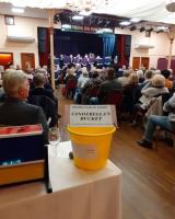 The 'Cinderella Bucket' Rotary Club members with guests and members of the public enjoying the concert.